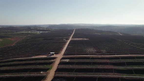 Giant solar panels farm field in Lagos, Portugal. Fly over on sunny day