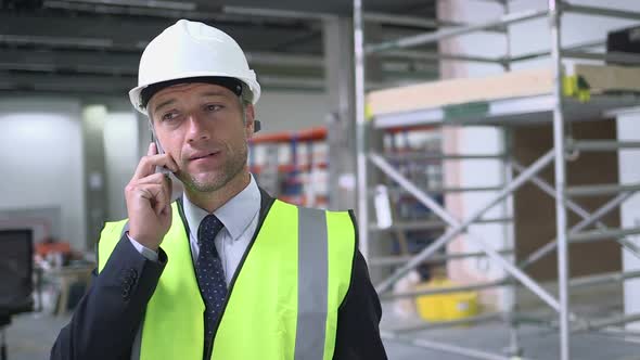 Man using mobile phone at construction site