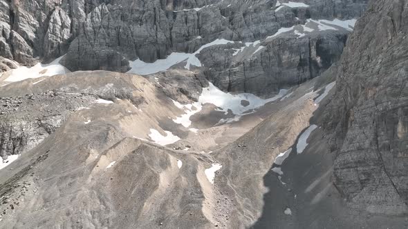 Hikers and travelers enjoy the beautiful mountain views as they have a walk in the Dolomites alt