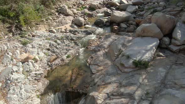 Large Stones And Creek At Yelapa Waterfall On Rainforest In Jalisco, Mexico. Pullback alt