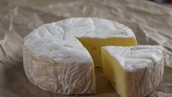 Rotating Camembert cream cheese, close-up, dairy product concept alt