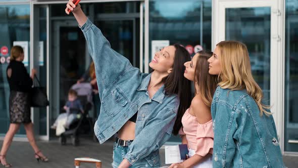 Girls Taking Selfie Near Airport alt
