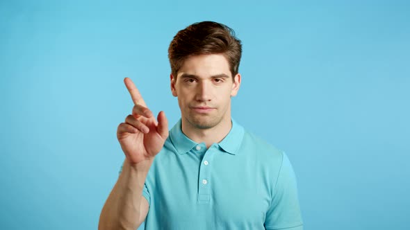 Man Disapproving with No Finger Sign Make Negation Gesture. Denying, Rejecting, Disagree, Portrait alt