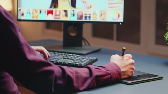 Close Up of Freelancer Retouching Working on Photos alt