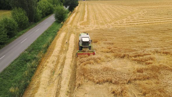 Drone View of a Modern Combine Harvester Reaping Wheat