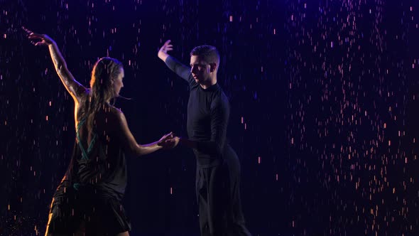 Passionate Bachata Dance Among the Raindrops Performed By a Young Sensual Couple of Dancers alt
