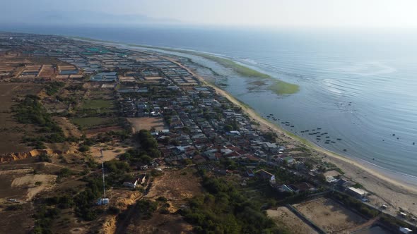 Beautiful aerial shot of coastal city with sandy beach and Ocean during sunny day - Ninh thuan, phan alt