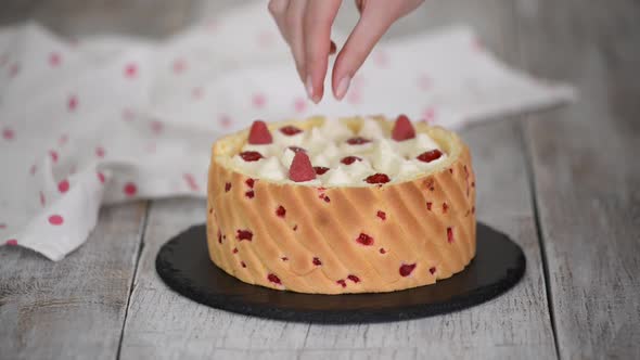 Chef Decorating Mousse Cake with Berry