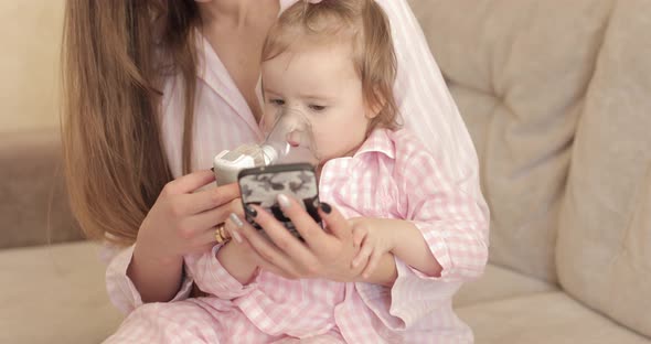 Mother Curing Little Daughter and Caring About Health