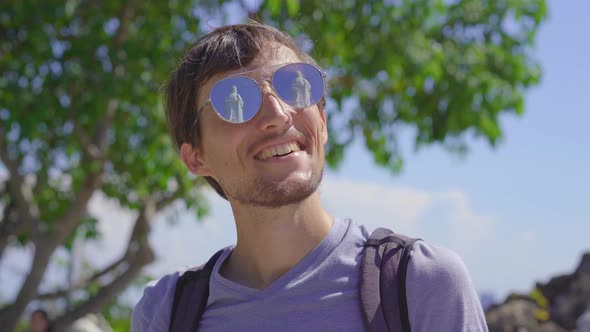 A Young Man Tourist Stands in Front of the Son Tra Linh Ung Pagoda Also Known As Ledy Buddha in the alt
