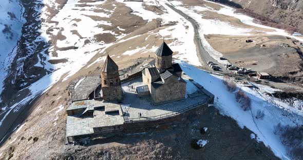 Aerial view of Gergeti Trinity Church, Tsminda Sameba in Kazbegi. Georgia 2022 alt