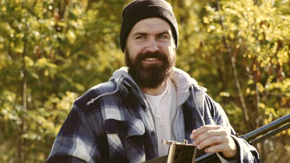 Hunter with Shotgun Gun After a Hunt. Hunting in Russia. Hunting Gear and Hunting Clothing. alt