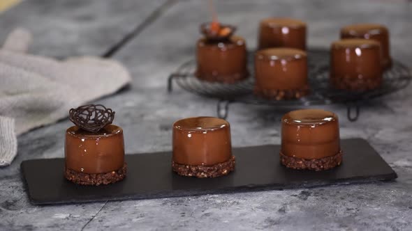 Pastry Chef Decorate Mini Mousse Pastry Dessert with Chocolate Nest