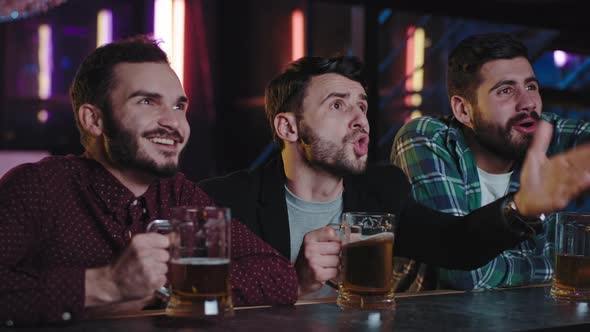 Happy Friends in a Pub While Drinking Some Beer alt