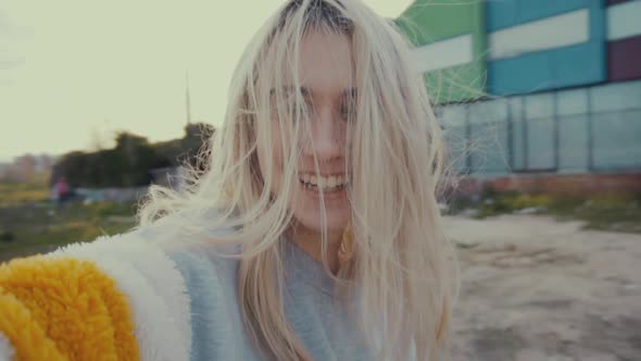 Cheerful woman grimacing for camera alt