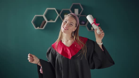 Happy Dancing Women Graduate with Diploma
