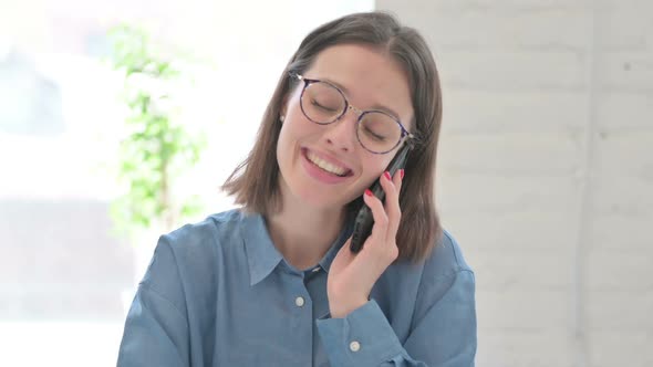 Young Woman Talking on Phone alt