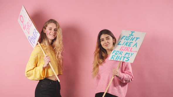 Two Female in Yellow and Pink Blouses Fight for Feminism