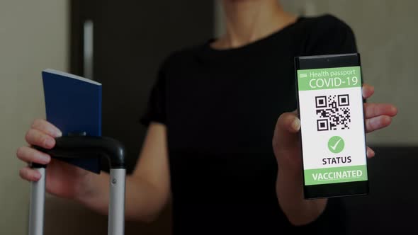 Vaccination Passport on a Mobile Phone Allowing Travel in Hand alt