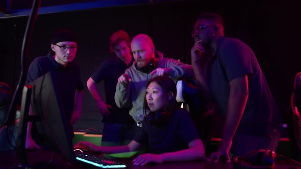 During a Training Session Before the Shooter Championship the Coach Explains Their Strategy to the alt