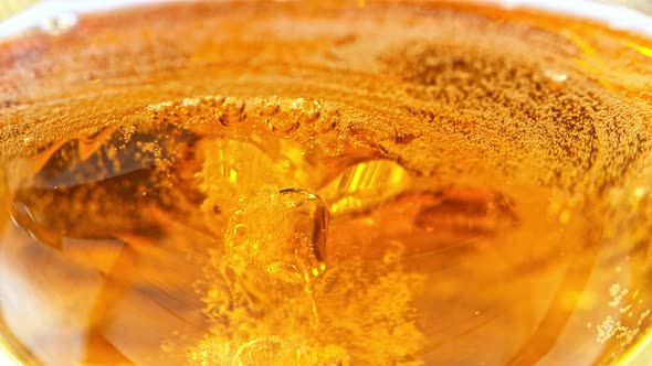 Super Slow Motion Detail Shot of Pouring Beer Into Glass at 1000Fps alt