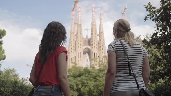 Female Tourists on vacation admiring Cathedral, Barcelona