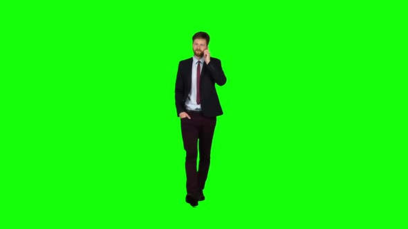 Businessman Walks Down the Street, Puts His Hand in His Pocket and Waves. Green Screen alt