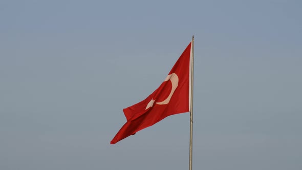 republic of turkey flag and blue sky with wind rippling, alt