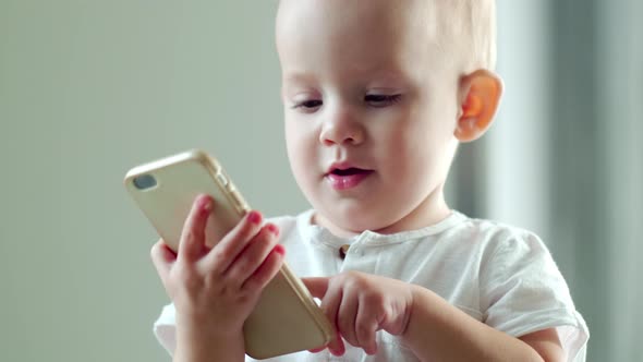 Baby Boy Tapping on Smartphone