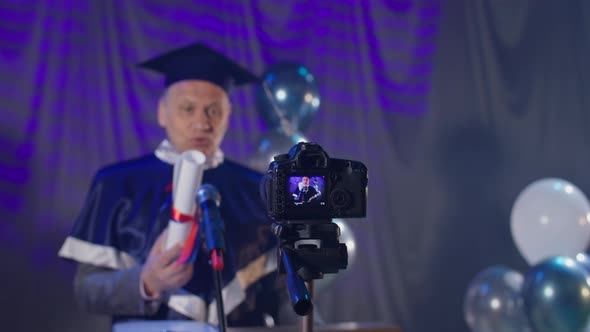 Male University Lecturer Presents Diplomas to Graduates Via Video Link Due to Quarantine and alt