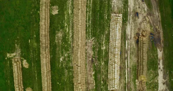 bales of straw in a field taken from a drone