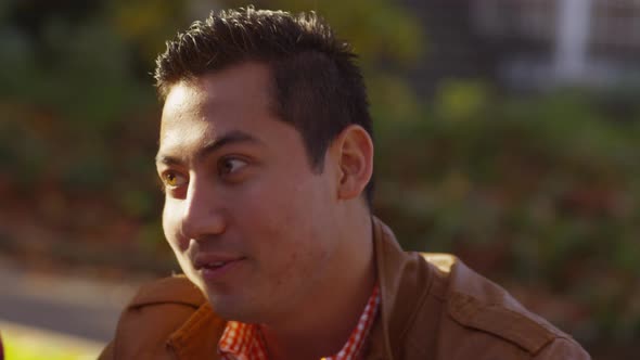 Closeup of college student on campus talking to classmates