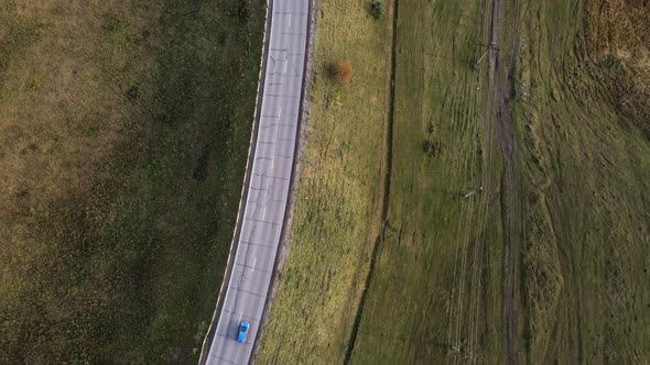 Aerial Top Down  View of Car Traffic Driving on Country Road alt