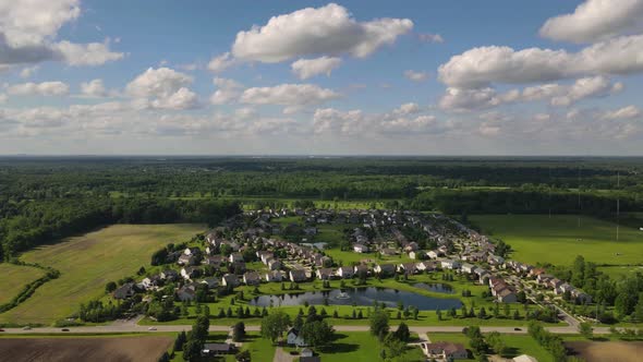 Timelapse of residential area on countryside in farm fields, south East Michigan, USA, Aerial view alt