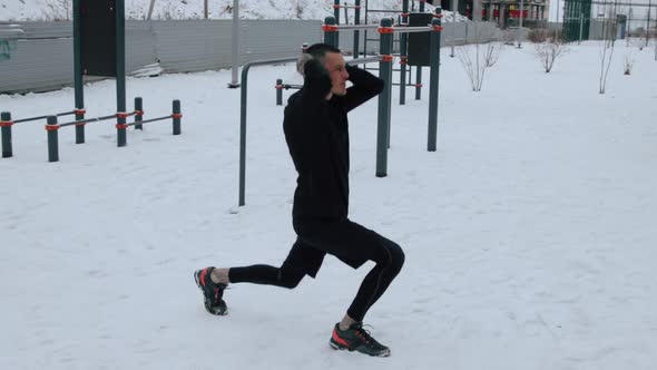 Man training outdoors on sports field in winter