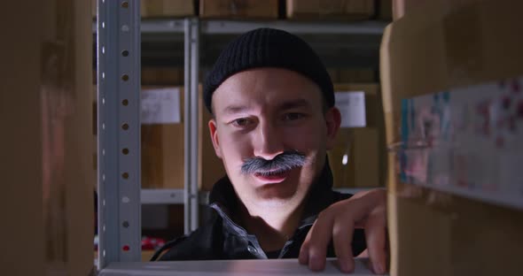 Grinning Guy with Thick Mustache is Standing in Semidarkness When He is Attacked By Dog in Handmade alt