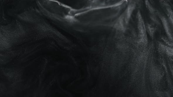 Super Slow Motion Shot of Black Glittering Liquid Background at 1000Fps alt