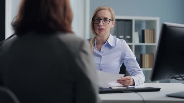 Woman Accepting Resume alt