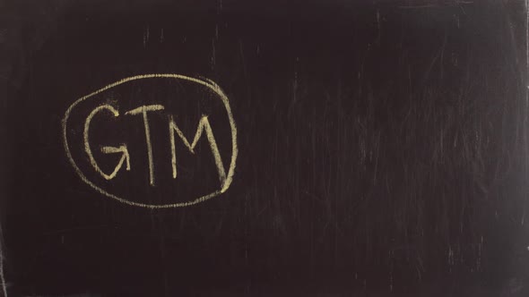 Shortening the phrase go to market in the form of letters GTM written on a chalkboard hand alt
