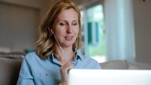 Woman Has Video Call Conference on Laptop Rbbro alt