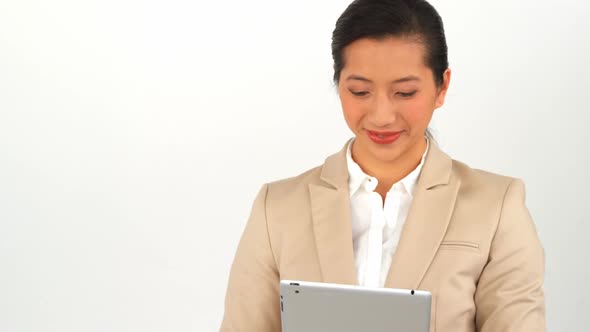 Businesswoman using digital tablet alt