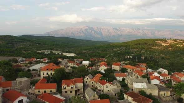 Ascending drone shot of the Selca Island Brac Croatia Europe alt
