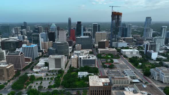 Truck shot of Austin, Texas skyline. Skyscrapers and cloudy sky in metropolitan setting. Urban, majo alt