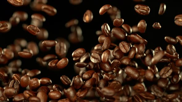 Super Slow Motion Shot of Exploding Premium Coffee Beans Towards the Camera at 1000Fps alt