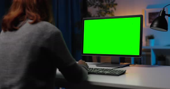 Woman Using Pc with Green Monitor