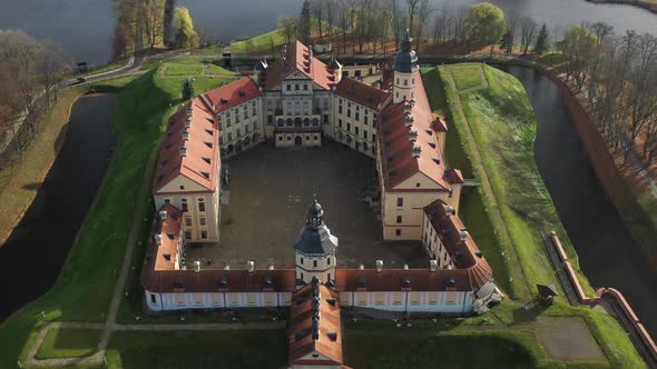 Flying Over the Nesvizh Castle the Park Around the Castle and the Lake Aerial Video of Nesvizh