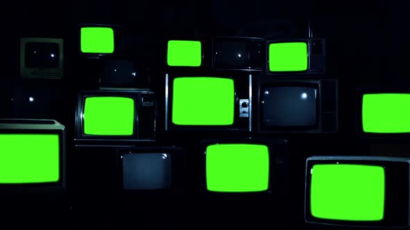 Heap of Vintage TV turning on Green Screens. Dark Tone., Stock Footage