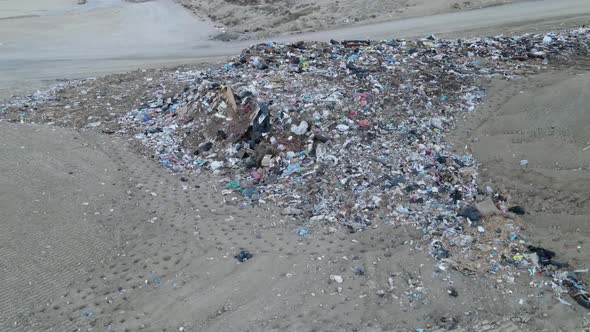 Aerial shot of a garbage dump alt