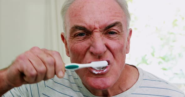 Senior Man Brushing His Teeth In Bathroom Stock Footage Videohive