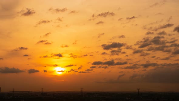 Time lapse sunset sunrise and beautiful twilight fluffy storm cloudy blue and yellow sky alt